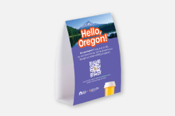 A table tent that says, "Hello Oregon!"